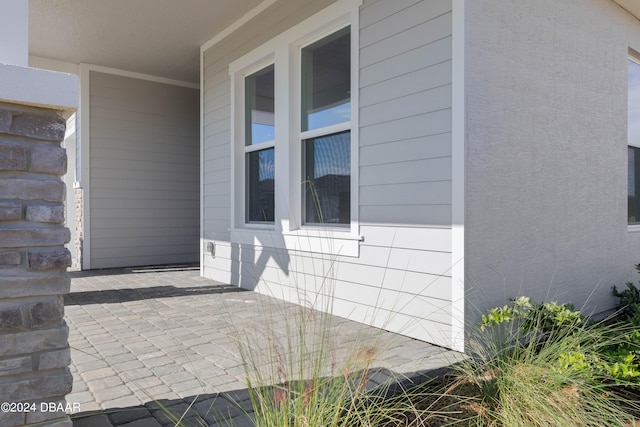 view of property exterior featuring a patio