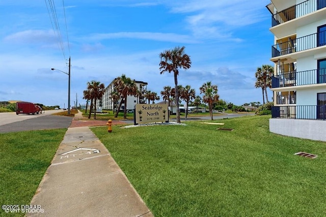 3170 Ocean Shore Blvd Unit 105, Ormond Beach, FL 32176 - surrounding community with a yard