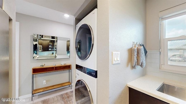 3170 Ocean Shore Blvd Unit 105, Ormond Beach, FL 32176 - laundry room with stacked washer / drying machine