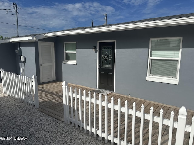 doorway to property with a wooden deck