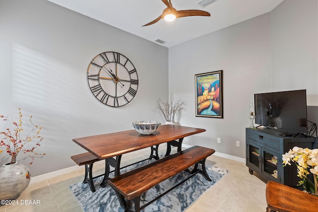 tiled dining room with ceiling fan