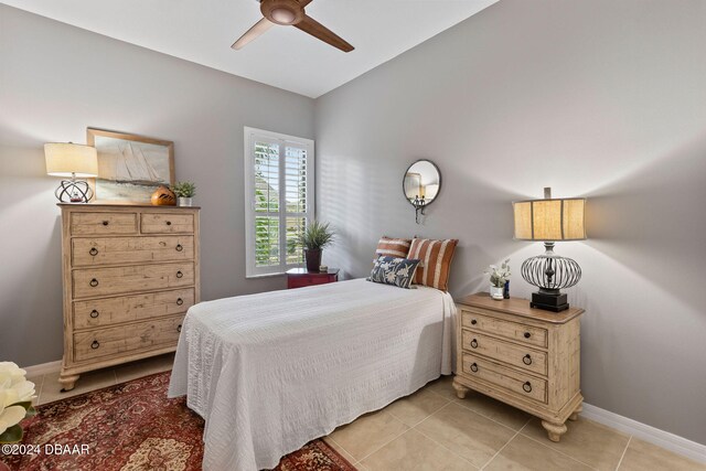 bedroom featuring ceiling fan and light tile patterned floors