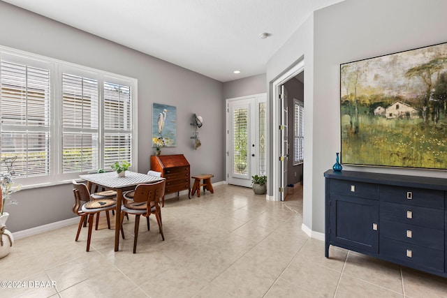 dining area with light tile patterned flooring