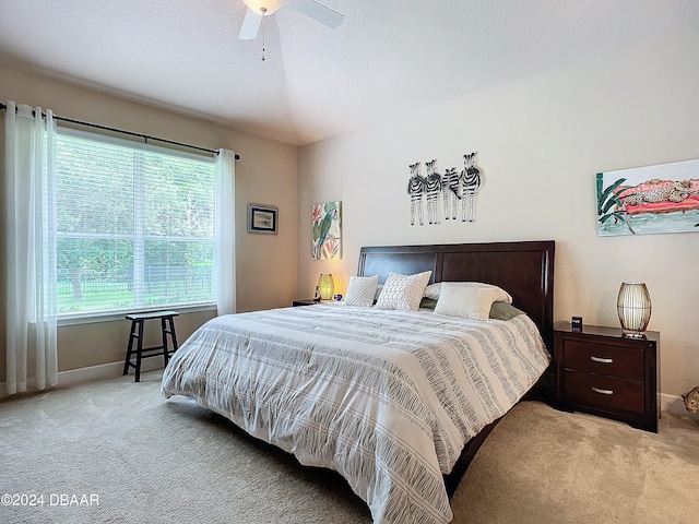 bedroom featuring ceiling fan and light colored carpet