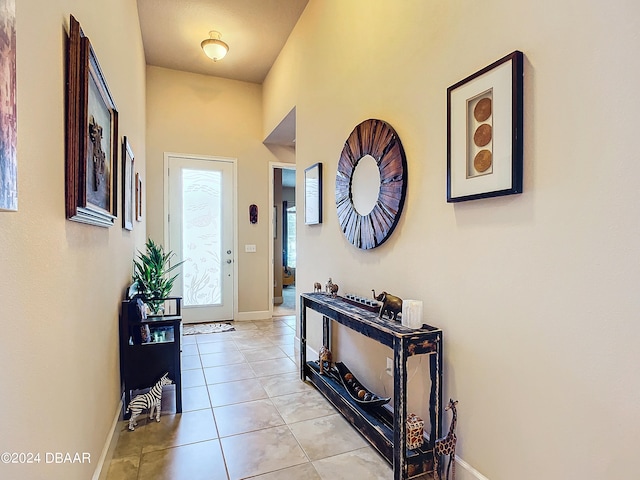 foyer entrance featuring light tile patterned floors