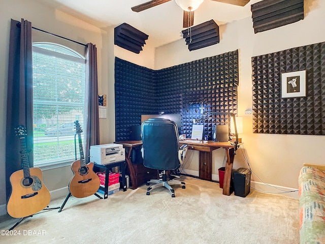 office space with ceiling fan, light carpet, and a healthy amount of sunlight