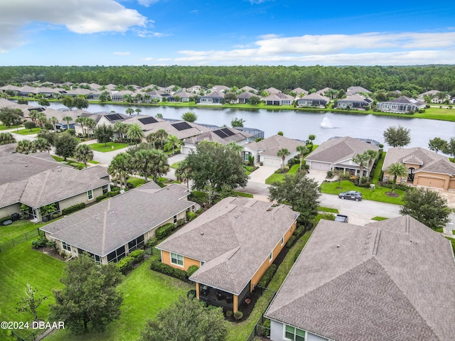 drone / aerial view with a water view