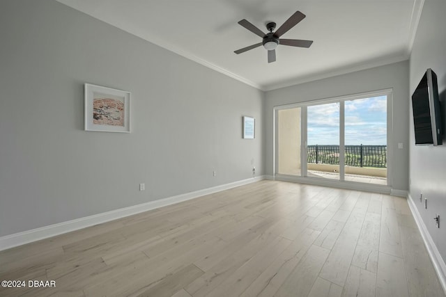 spare room with ceiling fan, ornamental molding, and light hardwood / wood-style flooring