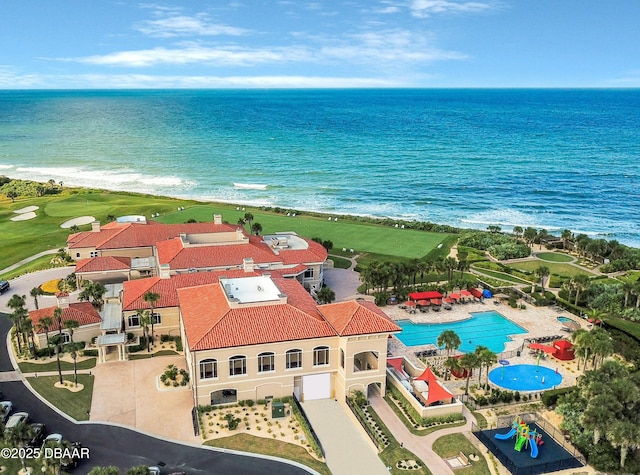 drone / aerial view with a water view and a view of the beach