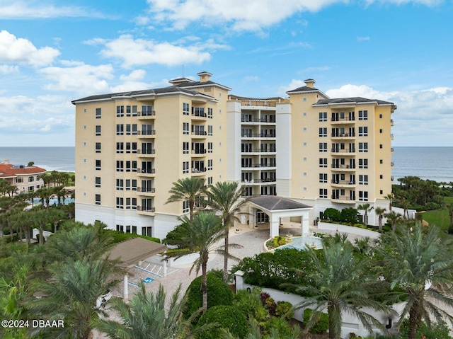 view of building exterior with a water view