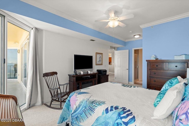 carpeted bedroom featuring ornamental molding and ceiling fan