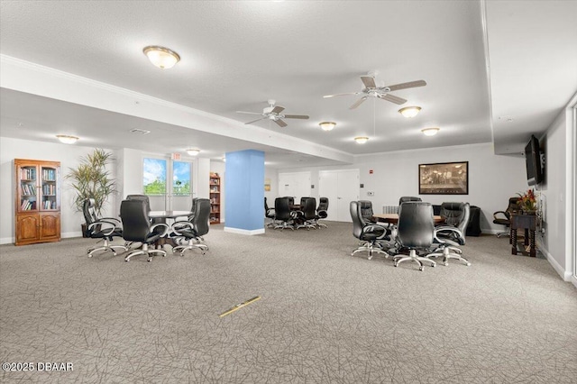 carpeted dining area featuring a textured ceiling