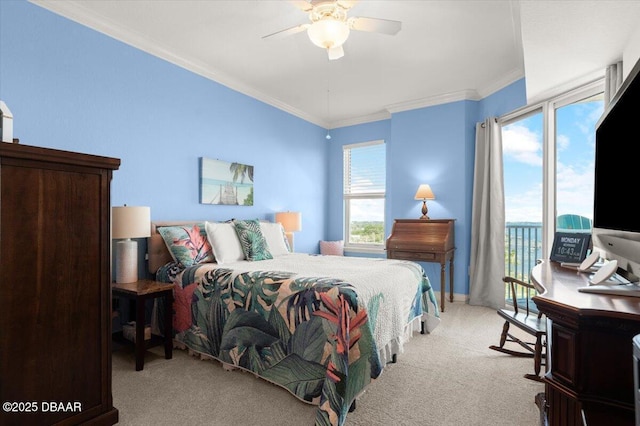 carpeted bedroom with ceiling fan, crown molding, and access to outside