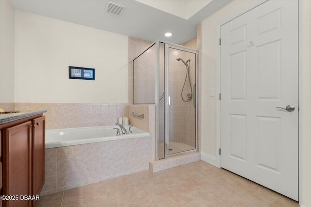 bathroom with separate shower and tub, vanity, and tile patterned floors