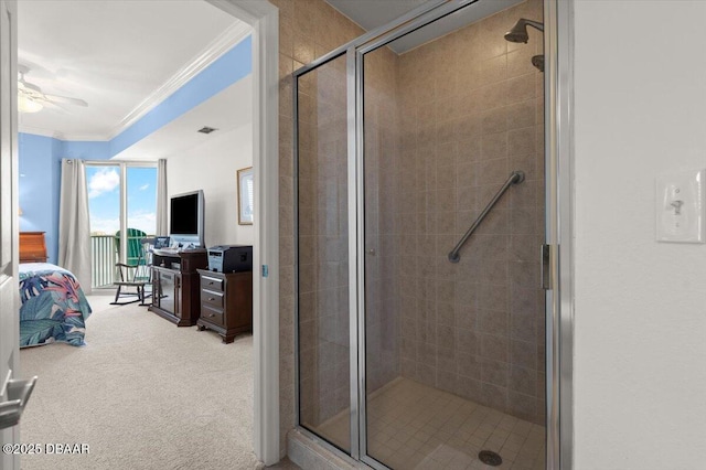 bathroom featuring walk in shower, crown molding, and ceiling fan