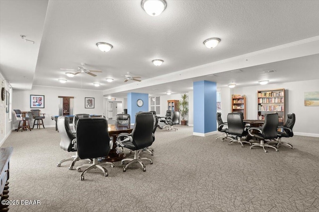 dining space featuring ceiling fan, light carpet, and a textured ceiling