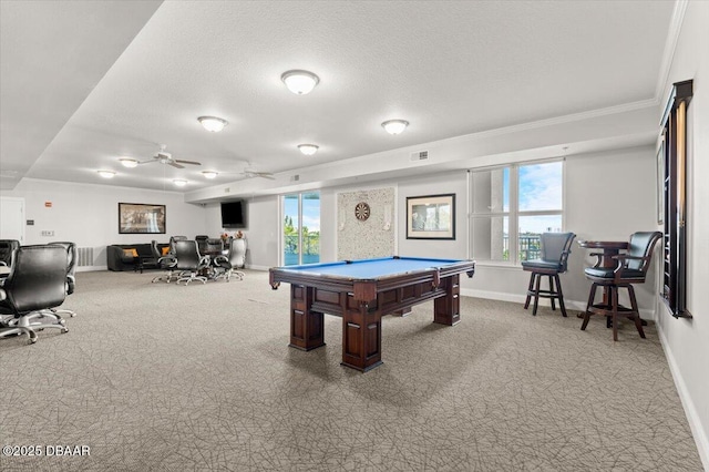 playroom with plenty of natural light, carpet floors, and a textured ceiling