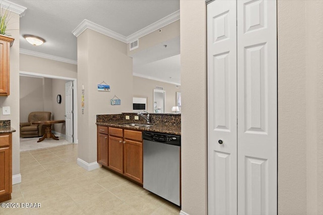 kitchen with sink, ornamental molding, dark stone countertops, and dishwasher