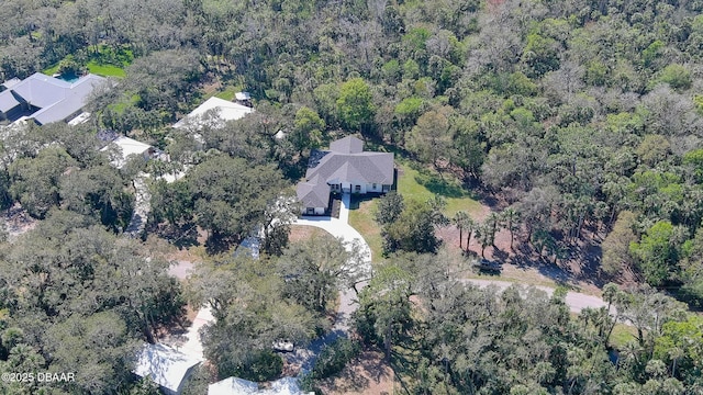 drone / aerial view with a view of trees