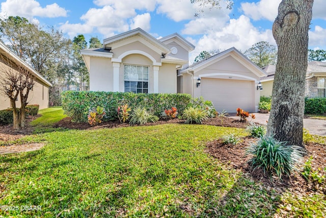 view of front of house with driveway, a garage, a front lawn, and stucco siding