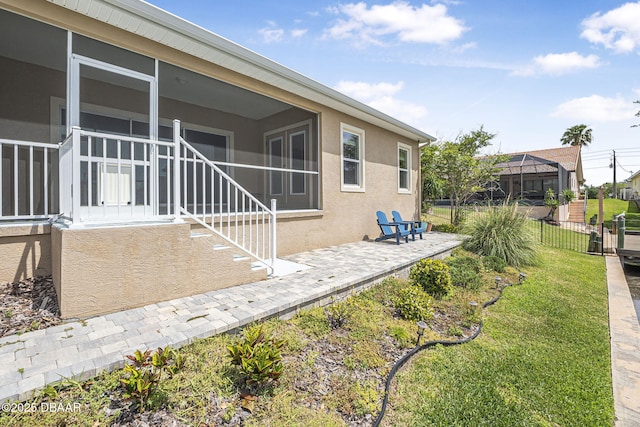 10 Creek Ct, Palm Coast, FL 32137 - exterior space with a patio, fence, and a sunroom