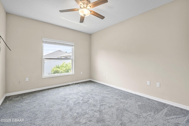 10 Creek Ct, Palm Coast, FL 32137 - spare room featuring baseboards, a ceiling fan, and carpet flooring