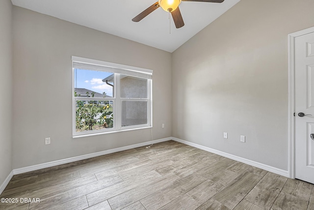 10 Creek Ct, Palm Coast, FL 32137 - unfurnished room featuring baseboards, ceiling fan, light wood-style floors, and vaulted ceiling