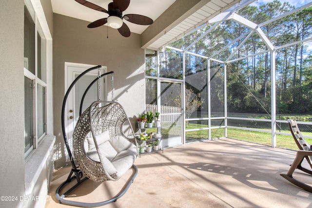 sunroom / solarium with ceiling fan