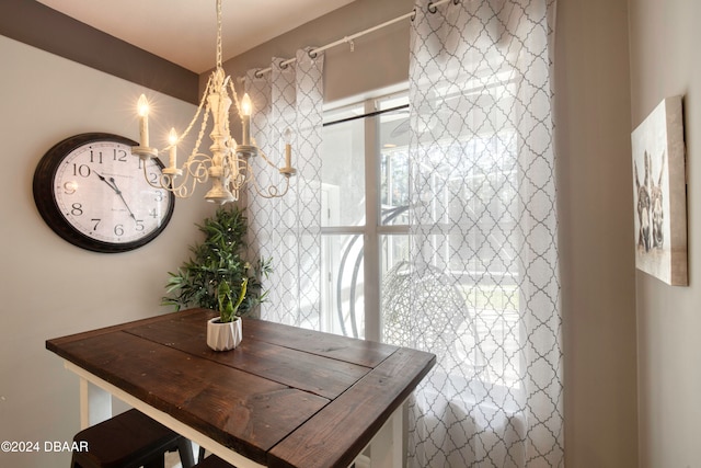 unfurnished dining area with a chandelier