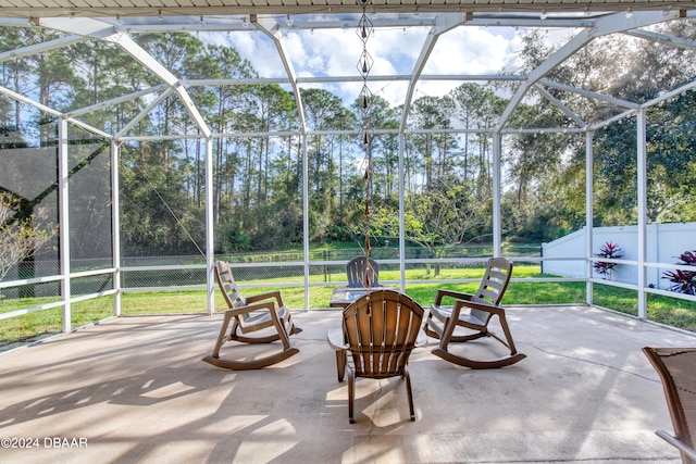 view of patio with glass enclosure