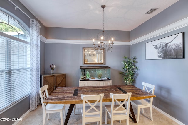 tiled dining room featuring a notable chandelier