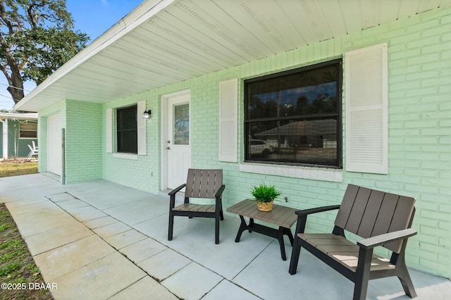 view of patio / terrace featuring a garage