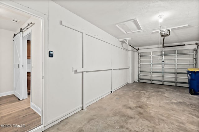 garage featuring baseboards and a garage door opener