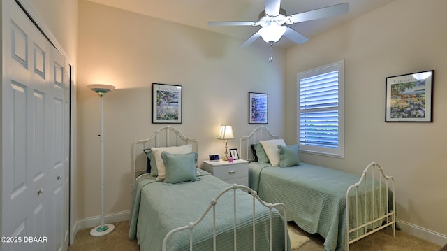 bedroom with baseboards, a ceiling fan, and carpet