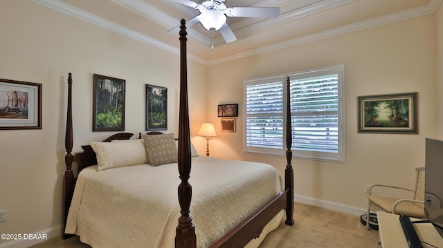 bedroom featuring ceiling fan, baseboards, a raised ceiling, ornamental molding, and carpet