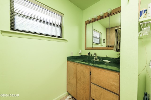 bathroom featuring vanity and baseboards