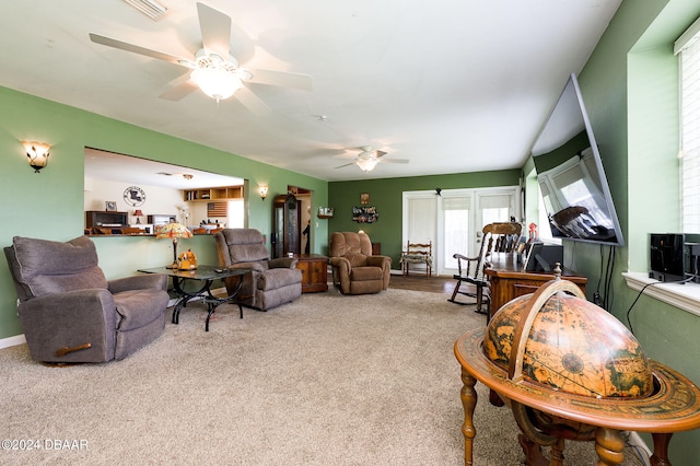 carpeted living area featuring ceiling fan and visible vents