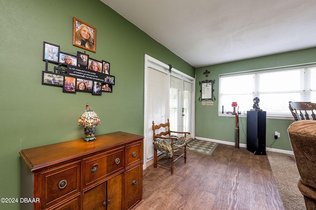 interior space featuring baseboards and dark wood-type flooring