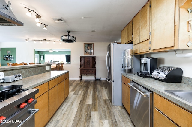 kitchen featuring under cabinet range hood, visible vents, appliances with stainless steel finishes, brown cabinets, and light wood finished floors