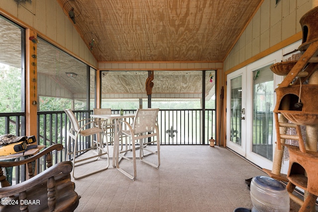 sunroom with wood ceiling and vaulted ceiling