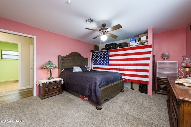 bedroom featuring carpet flooring, visible vents, and a ceiling fan