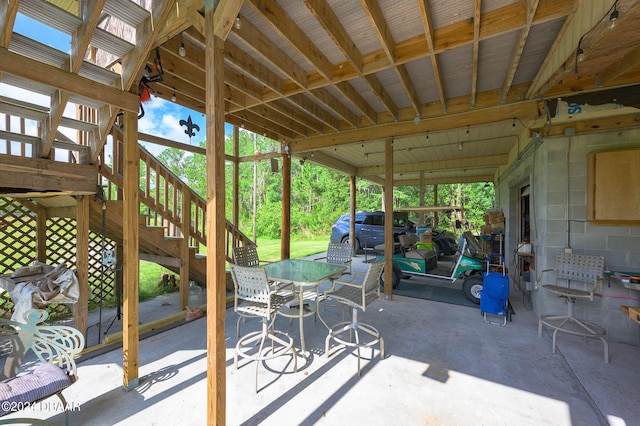 view of patio / terrace featuring stairs and outdoor dining area