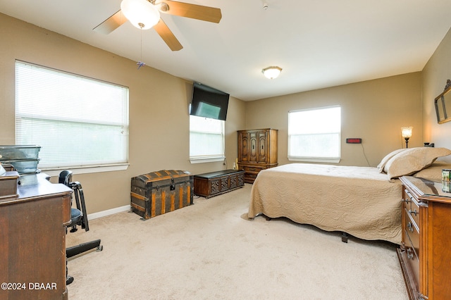 bedroom with carpet floors, baseboards, and a ceiling fan