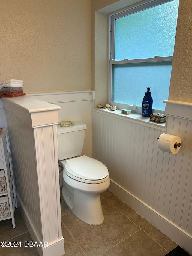 bathroom with tile patterned floors and toilet