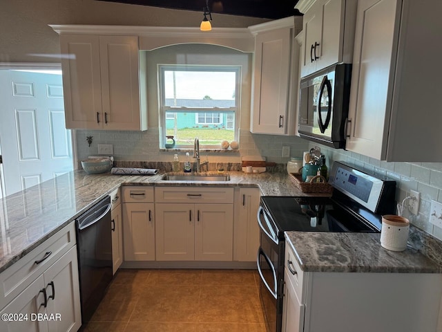 kitchen featuring white cabinetry, sink, and appliances with stainless steel finishes