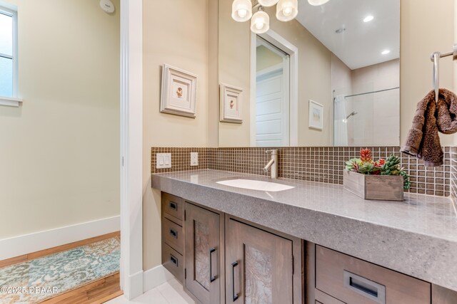 3 Ashford Lakes Dr, Ormond Beach, FL 32174 - full bathroom featuring backsplash, vanity, a tile shower, and recessed lighting