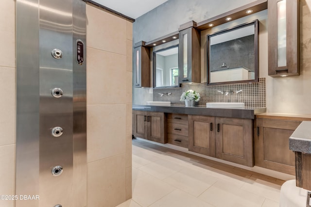 3 Ashford Lakes Dr, Ormond Beach, FL 32174 - bathroom featuring double vanity, tasteful backsplash, and tile patterned flooring