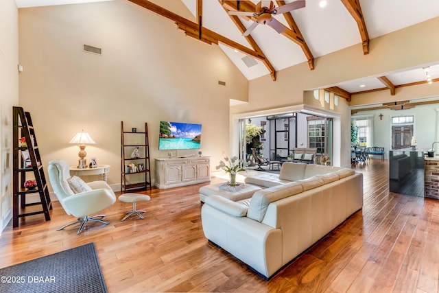 3 Ashford Lakes Dr, Ormond Beach, FL 32174 - living room featuring beam ceiling, wood finished floors, high vaulted ceiling, baseboards, and a ceiling fan