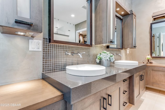3 Ashford Lakes Dr, Ormond Beach, FL 32174 - full bath featuring tasteful backsplash, double vanity, and tile patterned floors