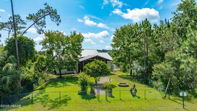 3 Ashford Lakes Dr, Ormond Beach, FL 32174 - view of community with an outdoor fire pit